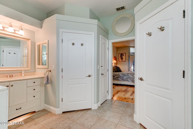 3102 N Springwater Ct N, Port Orange, FL 32128 - ensuite bathroom featuring vanity and tile patterned floors