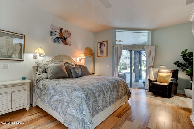 3102 N Springwater Ct N, Port Orange, FL 32128 - bedroom with access to outside, light wood-type flooring, a ceiling fan, and vaulted ceiling