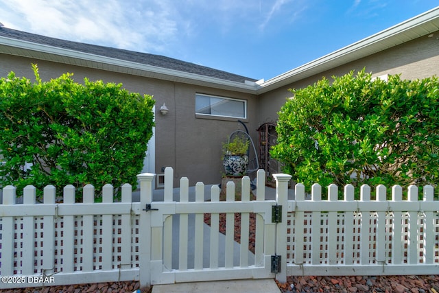 3102 N Springwater Ct N, Port Orange, FL 32128 - view of home's exterior with a gate and stucco siding