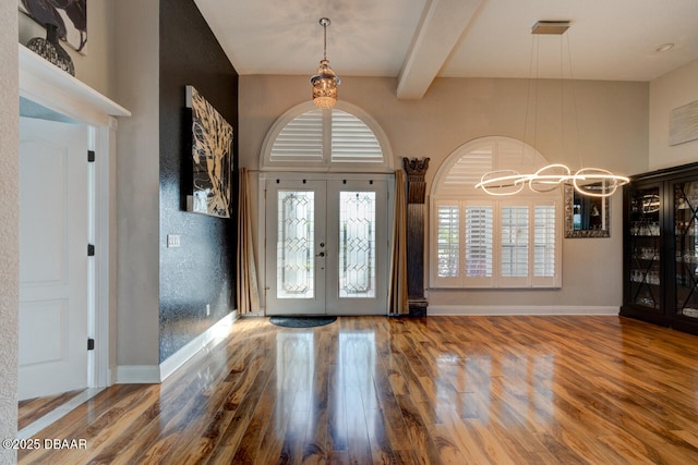 3102 N Springwater Ct N, Port Orange, FL 32128 - entryway featuring a chandelier, french doors, wood finished floors, and beam ceiling