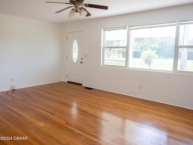 entryway with ceiling fan and light hardwood / wood-style flooring