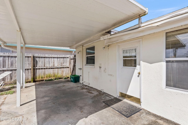 view of patio featuring fence