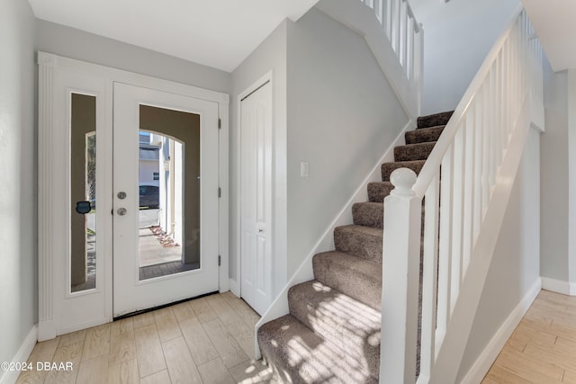 entryway with light hardwood / wood-style floors