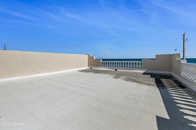 view of patio with a water view