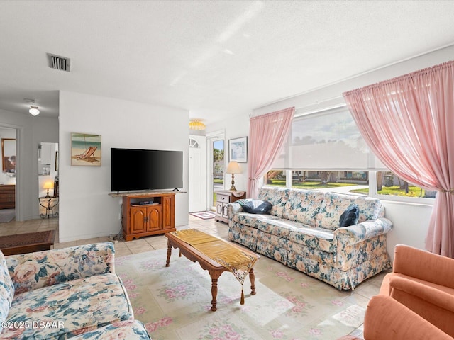 living room with light tile patterned flooring