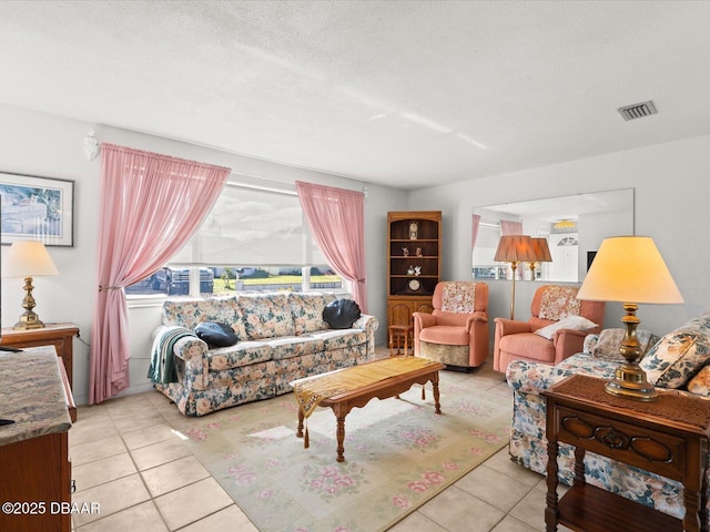 tiled living room with a textured ceiling