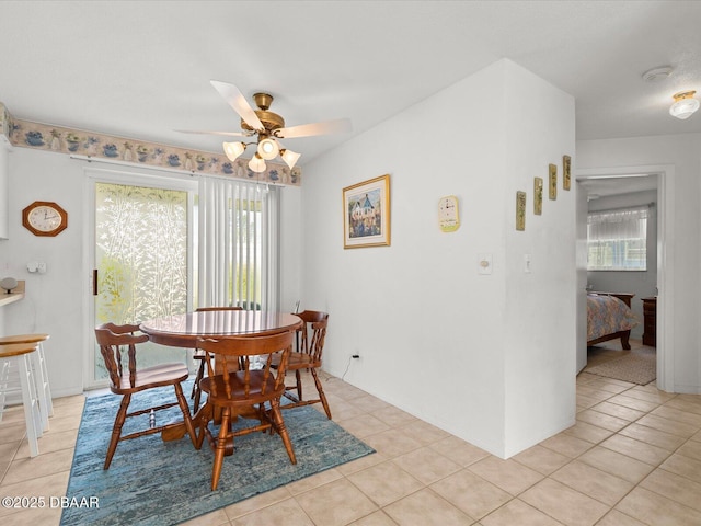 dining room featuring ceiling fan and light tile patterned floors