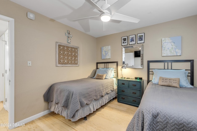 bedroom featuring light wood-type flooring and ceiling fan