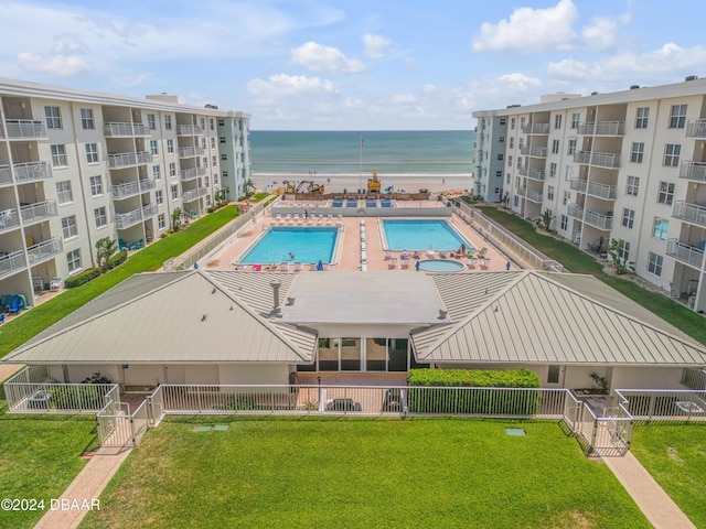 4151 S Atlantic Ave Unit 1120, New Smyrna Beach, FL 32169 - aerial view of a pool and a nearby body of water