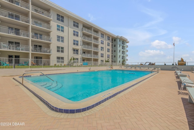 view of pool featuring a patio