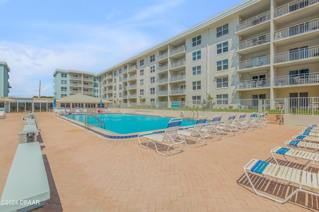 view of swimming pool with a patio