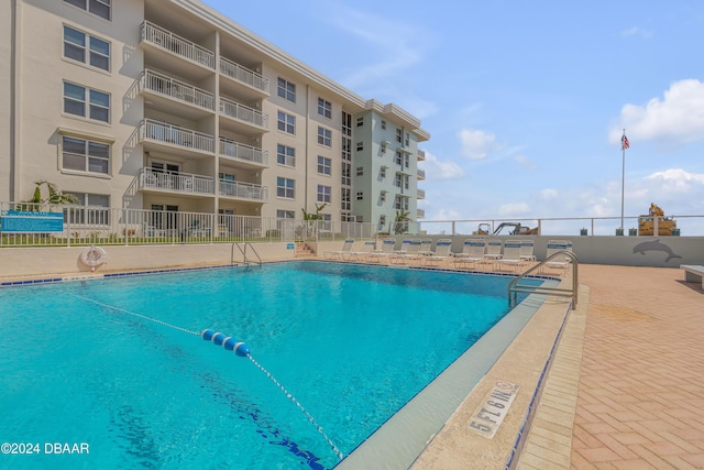 view of swimming pool with a patio area