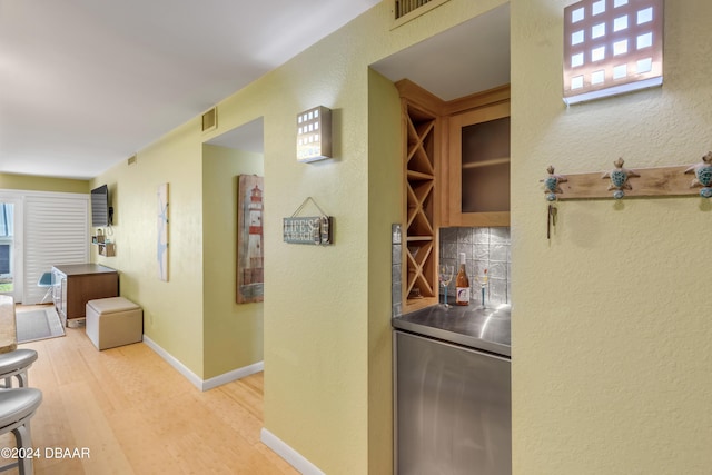 hall featuring light hardwood / wood-style flooring