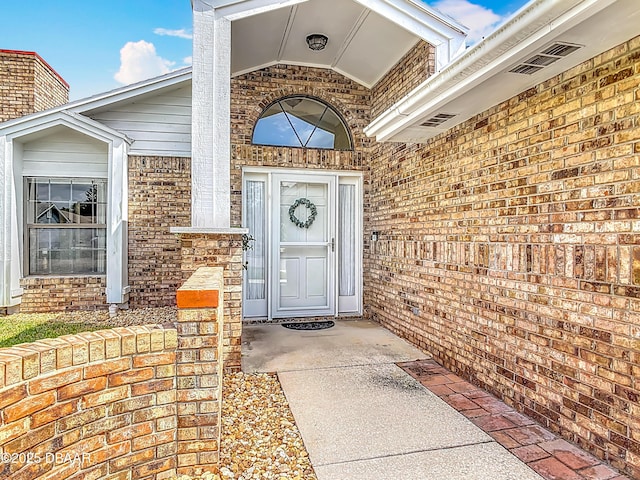 907 Silverleaf Pl, Port Orange, FL 32127 - property entrance with a chimney and brick siding