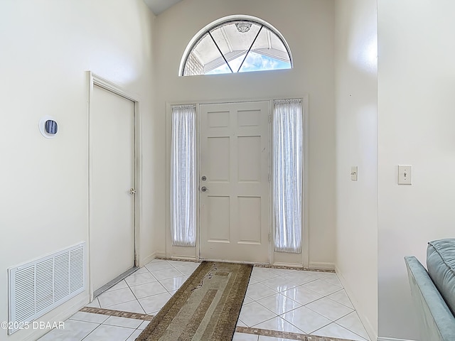 907 Silverleaf Pl, Port Orange, FL 32127 - entryway featuring a towering ceiling, baseboards, light tile patterned floors, and visible vents