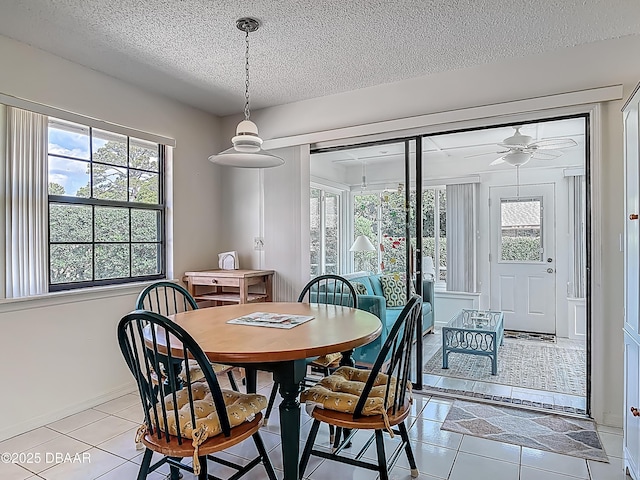 907 Silverleaf Pl, Port Orange, FL 32127 - dining space with ceiling fan, a textured ceiling, and a healthy amount of sunlight