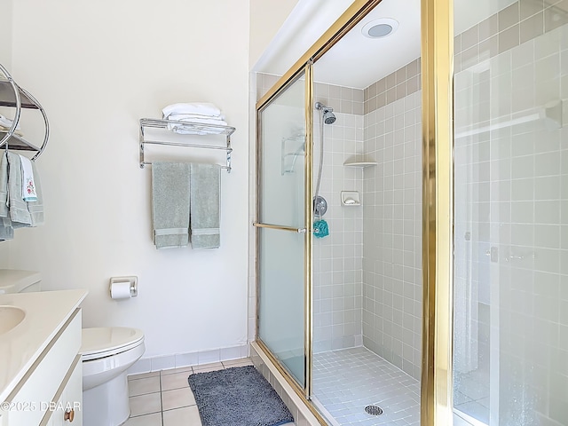 907 Silverleaf Pl, Port Orange, FL 32127 - bathroom featuring tile patterned floors, vanity, toilet, and a shower stall