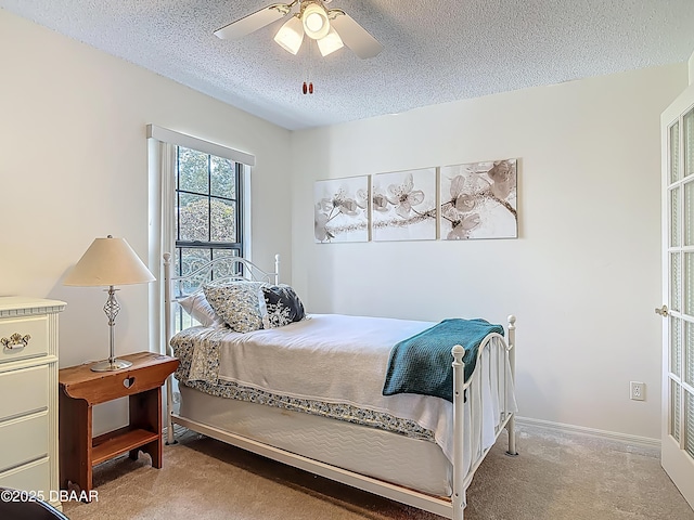 907 Silverleaf Pl, Port Orange, FL 32127 - bedroom featuring carpet flooring, a textured ceiling, baseboards, and ceiling fan