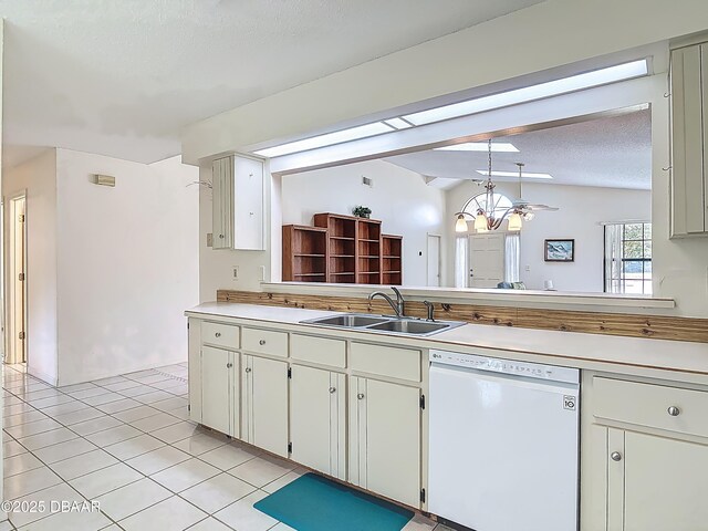 907 Silverleaf Pl, Port Orange, FL 32127 - kitchen with white dishwasher, light tile patterned floors, an inviting chandelier, a sink, and light countertops