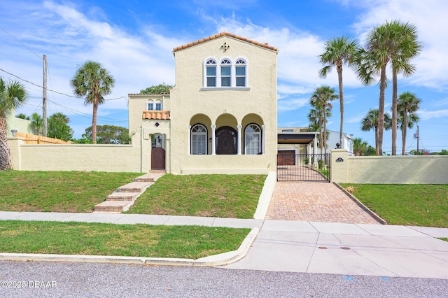 319 Wisteria Rd, Daytona Beach, FL 32118 - mediterranean / spanish home featuring a front yard