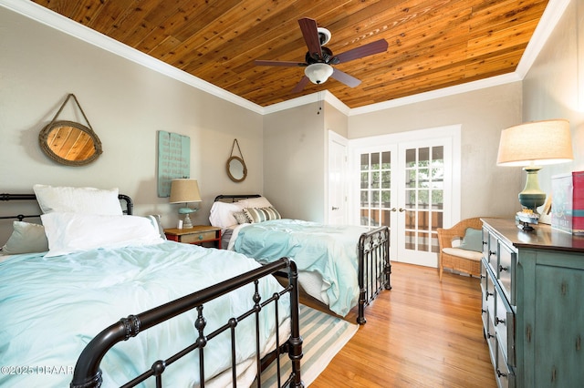 bedroom with ornamental molding, ceiling fan, light wood-type flooring, and wood ceiling