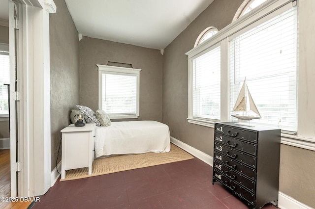 bedroom with multiple windows