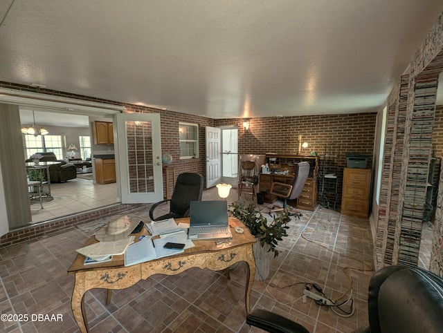 home office featuring brick wall