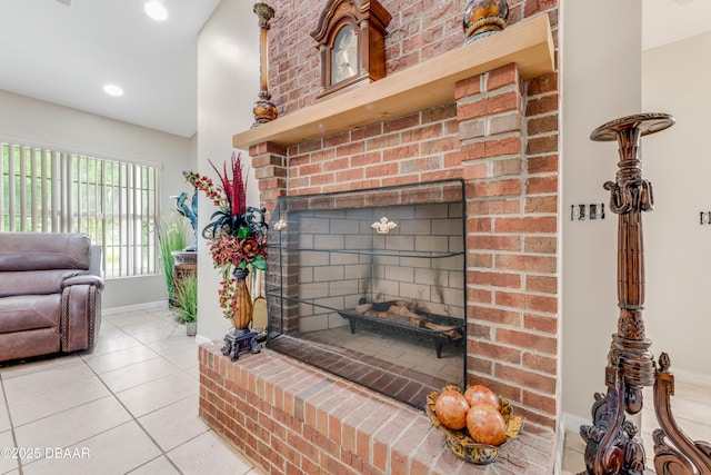 interior details with a brick fireplace, baseboards, and recessed lighting