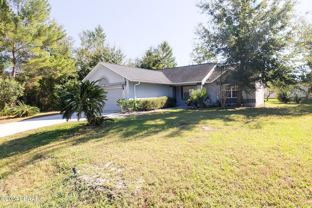 ranch-style house with a garage and a front lawn