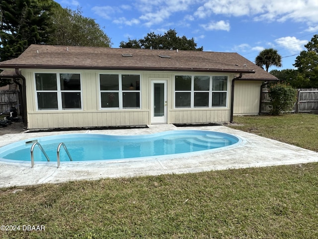 1824 Sabal Palm Dr, Edgewater, FL 32132 - back of house featuring a patio area and roof with shingles