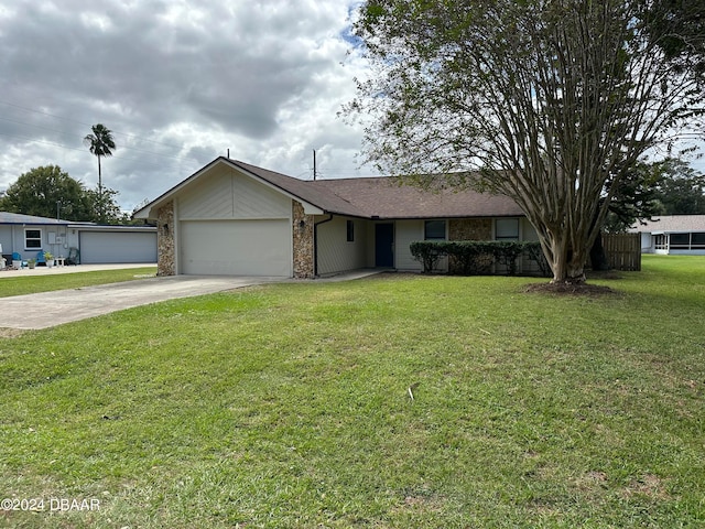 ranch-style home with a garage and a front yard