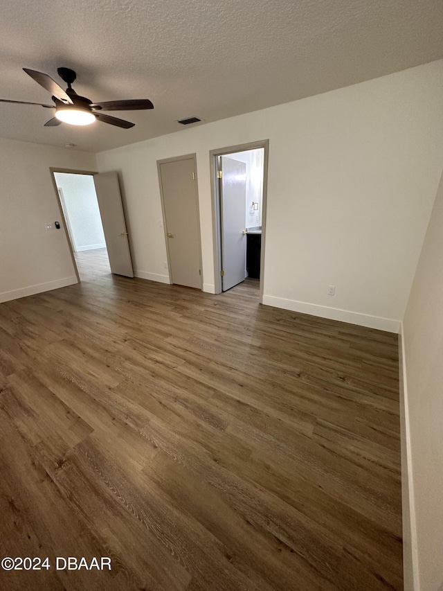 1824 Sabal Palm Dr, Edgewater, FL 32132 - unfurnished room featuring wood finished floors, baseboards, a ceiling fan, and a textured ceiling