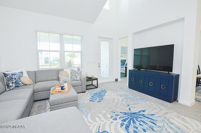 467 Salty Lime Pl, Daytona Beach, FL 32124 - living room featuring a towering ceiling and baseboards