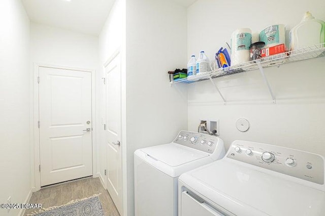 467 Salty Lime Pl, Daytona Beach, FL 32124 - laundry area with light wood-type flooring, baseboards, laundry area, and washer and clothes dryer