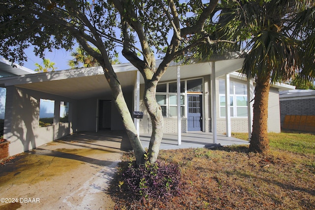 view of front of home with a carport