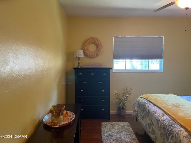 bedroom featuring dark wood-type flooring and ceiling fan