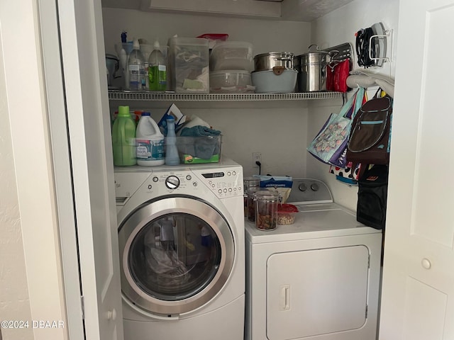 laundry room with separate washer and dryer