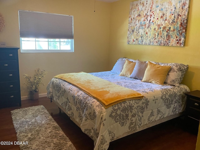 bedroom featuring dark hardwood / wood-style floors