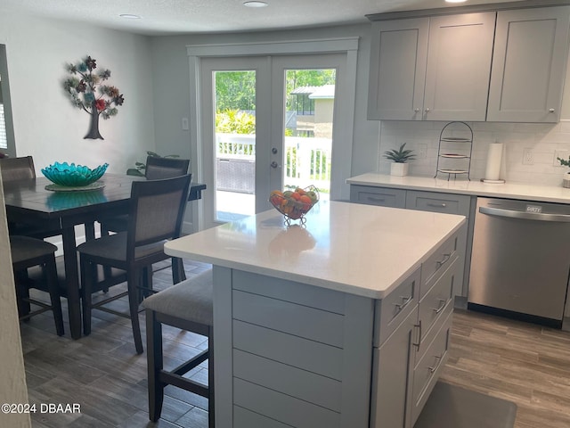 60 Bramblewood Ln, Ormond Beach, FL 32174 - kitchen featuring stainless steel dishwasher, gray cabinetry, light countertops, dark wood-style floors, and recessed lighting