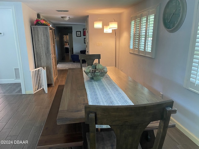 dining room with dark wood-type flooring