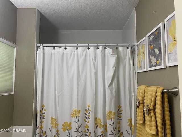 bathroom featuring a textured ceiling