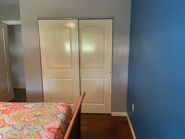 60 Bramblewood Ln, Ormond Beach, FL 32174 - bedroom featuring dark wood finished floors, a closet, and baseboards
