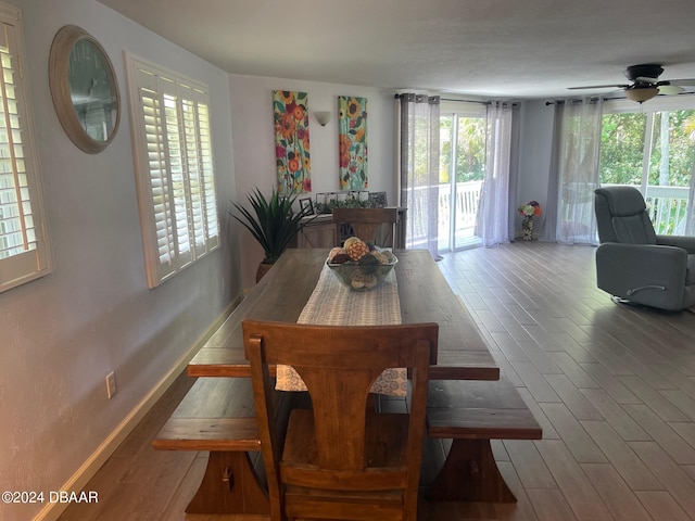 dining room with hardwood / wood-style floors and ceiling fan