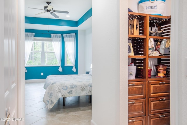 tiled bedroom with ceiling fan