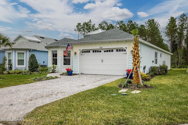 ranch-style home with a front yard and a garage