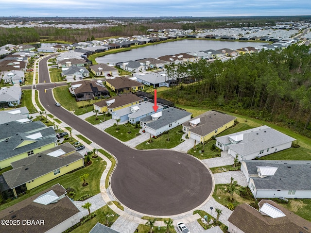 bird's eye view with a water view