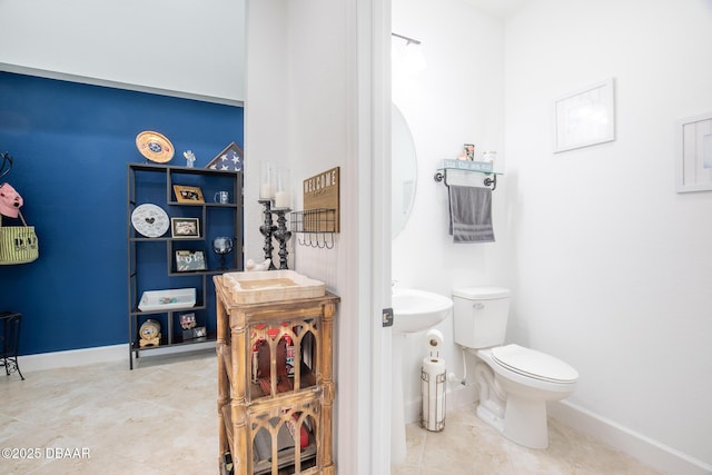 bathroom featuring tile patterned floors and toilet