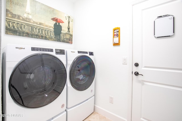 washroom featuring light tile patterned flooring and separate washer and dryer