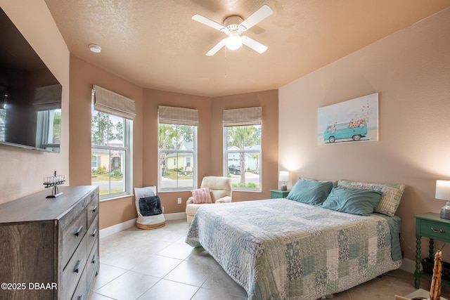 tiled bedroom with ceiling fan