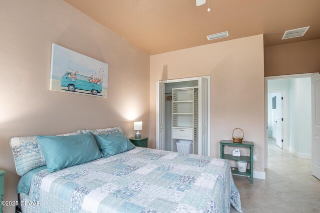 tiled bedroom featuring a closet